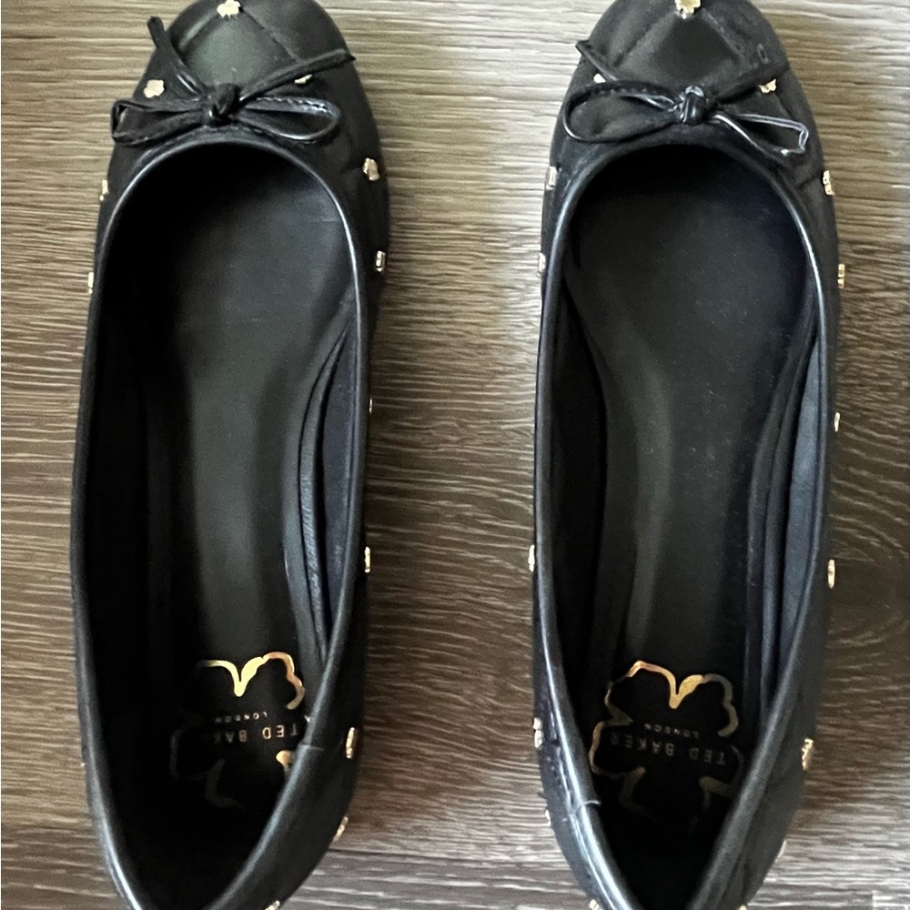 Ted Baker Black Flats with Gold Accents
